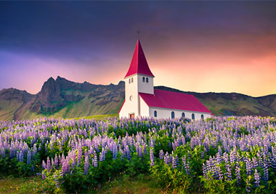 Beautiful architecture in field with mountains in background